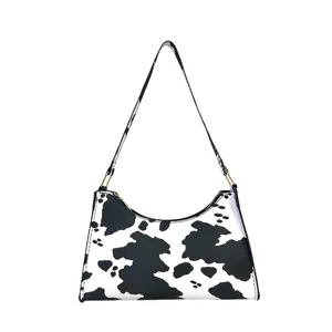 Stylish cow print underarm bag with retro black and white dairy pattern shoulder handbag