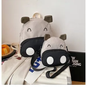 Set aus süßem Kinderrucksack und Umhängetasche mit Cartoon-Kuh-Motiv für die Schule