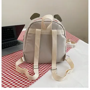 Rückansicht eines süßen grauen Kuh-Cartoon-Rucksacks für Kinder mit verstellbaren Trägern
