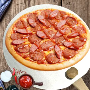 Professional 12 inch stainless steel pizza peel with wooden handle holding a fresh pizza