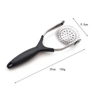 Detailed macro view of a manual stainless steel potato masher with size markings.
