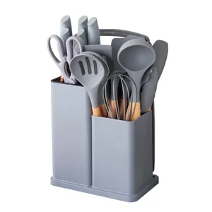 Silicone kitchen utensils set with wooden handle and storage holder for home cooking.