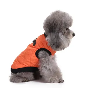 Side view of a premium orange quilted warm winter dog jacket on a gray poodle mascot.