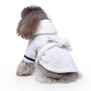 Back view of a dog wearing a white fluffy hooded bathrobe with a waist tie belt.