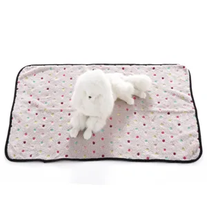 Double-sided fleece pet blanket with colorful paw print design for dogs and cats indoor.