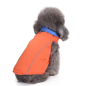 Close-up of orange dog winter jacket featuring a reflective strip and blue collar