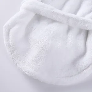 Macro detail showing the soft and thick white plush texture of a luxury pet bathrobe