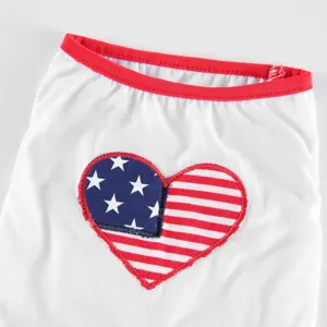 Detailed view of white pet summer dog clothes featuring red collar trim and cute patriotic heart patch.