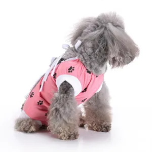 Breathable pink dog surgical suit with cute paw prints and adjustable ties for post-op care.