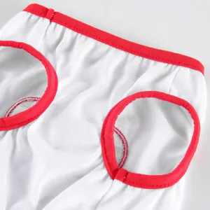 Close-up detail of pet clothing featuring soft white fabric and vibrant red trim design.