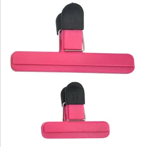 Two sizes of pink plastic bag sealing clips with black rubber grips for food storage