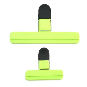 Set of two lime green plastic food bag sealing clips in different sizes for kitchen