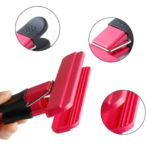 Detailed view of pink and black plastic food sealing clip with non-slip ridges
