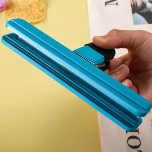 Detailed view of a blue plastic multi-purpose bag sealing clip for food and snacks