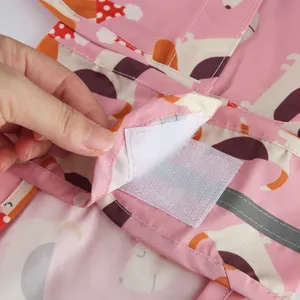Pink cute dog raincoat with reflective strip and velcro closure for pets outdoor walking.