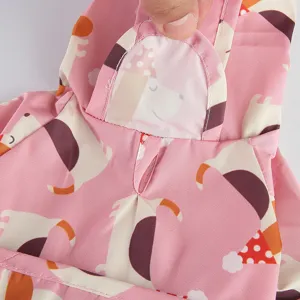 Pink pet raincoat detail with cute dog print, waterproof hooded puppy clothing for small dogs.