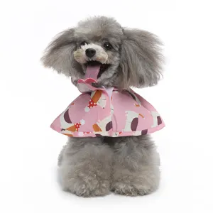 Cute pink dog raincoat detail featuring adorable puppy print and comfortable cape design for pets.