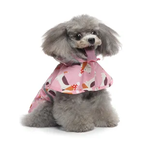 Pink pet dog raincoat, cute hooded design, reflective strips, waterproof apparel.
