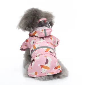 Detailed view of the pink pet raincoat with cute dog pattern and reflective safety strips.