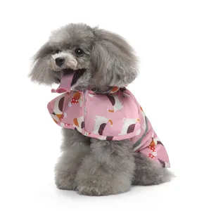 Cute pink dog raincoat detail shot, hooded design with cartoon duck pattern and reflective strip.