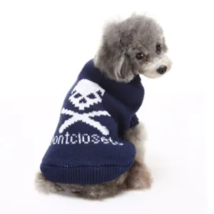 Navy blue knitted dog sweater featuring a pixel skull graphic and montcloset text design