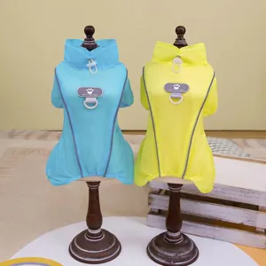 Detail view of blue and yellow reflective dog sun-protection jackets on mannequins.