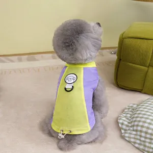 Detailed back view of a vibrant purple and yellow sun protection cooling vest worn by a poodle