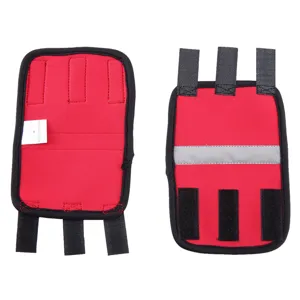 Detailed view of red dog elbow protector with reflective strip and velcro straps