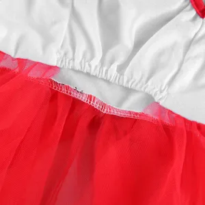 Detailed shot of pet summer dog dress featuring white top and red tulle skirt tier.