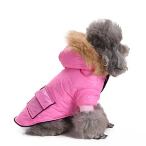 Detail view of pink quilted dog jacket with faux fur hood on a grey poodle model
