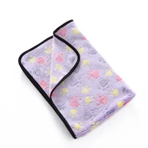 Soft fleece pet blanket with cute paw print pattern and black binding edge for dogs and cats.