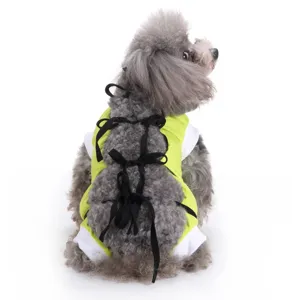 Pet dog surgical recovery suit detail showing lime green fabric and black back strap design.