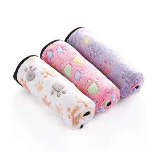 Cozy fleece pet blanket with cute paw prints, soft double-sided dog and cat mat for all seasons.