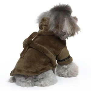 Back view of a small dog wearing a soft brown plush bathrobe featuring a tie belt.