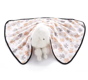 Soft pet blanket with cute paw print design, warm double-sided fleece for dogs and cats home.
