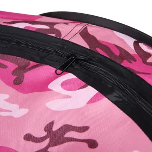Close up view of pink camo pet tent fabric and black zipper detail, durable material.
