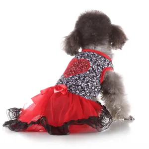 Charming pet dog dress featuring black and white pattern, red heart, and red tutu with lace.