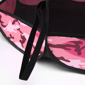 Detailed view of pink camouflage pet playpen fabric with black mesh and elastic strap.