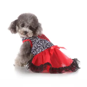 Detailed shot of a cute pet dog summer dress with red mesh skirt and black lace trim.