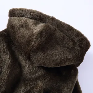 Detailed macro view of high-quality soft brown thick plush fabric on pet bathrobe