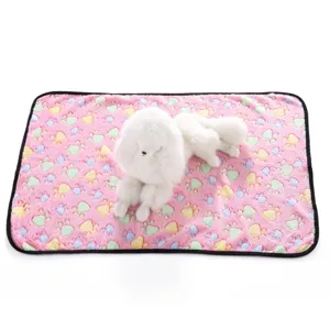Pink pet blanket with colorful paw print, double-sided fleece detail for cozy pet resting.