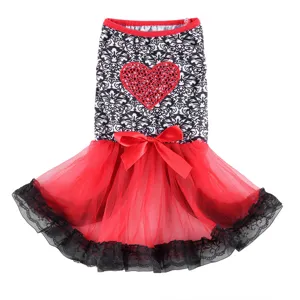 Chic summer pet dress for dogs, featuring black and white pattern with red tulle skirt details.