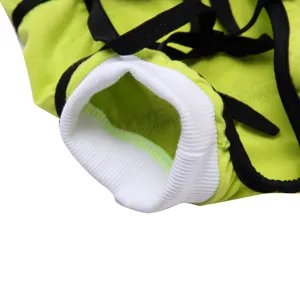 Detailed view of pet surgical recovery suit with green fabric, black straps, white cuff.