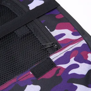 Detail view of foldable pet playpen zipper mesh and purple camo fabric construction.