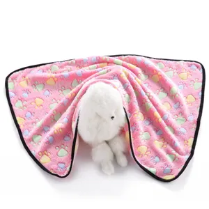 Soft pink fleece pet blanket with cute colorful paw print design, warm and cozy for cats and dogs.