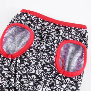 Pet dog summer dress detail view, black and white printed fabric with red trim design.