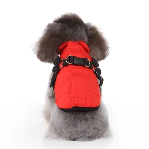 Red quilted winter dog jacket featuring integrated harness and D-rings for pets