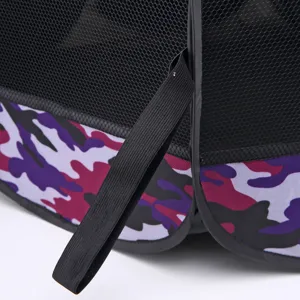 Close-up detail of foldable pet playpen mesh and purple camouflage fabric with elastic strap.