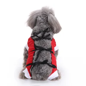 Back view close-up of a pet surgical recovery suit with black ribbon ties in red fabric.
