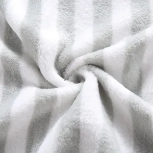 Soft double-sided fleece pet blanket detail, grey and white striped plush fabric texture.
